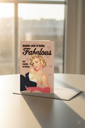 Another Year of Being Fabulous greeting card mockup with window sunlight